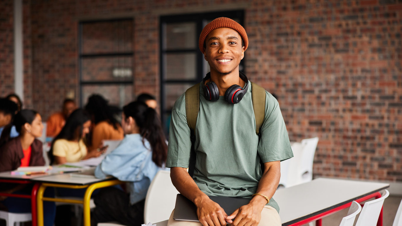 Photo of a student looking into camera.